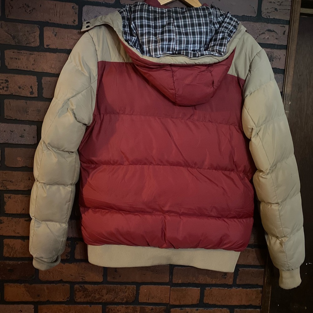 Women’s beige and orange bomber jacket.